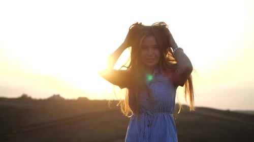 Close Up Portrait of Smiling Feminine Girl Looking To Camera in Rural Landscape. Attractive Young