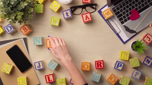 Woman Hand Arranging Wooden Cubes with Word NETWORK Top View
