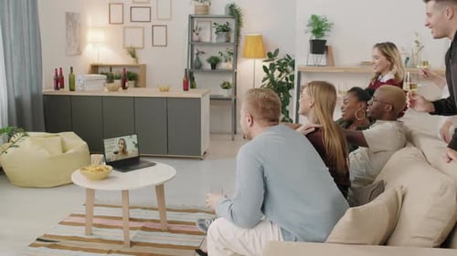 Friends Celebrating Together via Video Call at Home