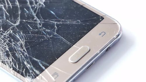 Close Up of Broken Smart Phone on White Background