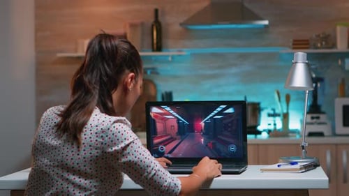 Gamer Playing Professional Game on Laptop at Home