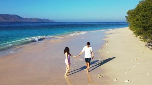 Happy Man and Woman on Romantic Honeymoon Spend Quality Time on Beach on Sunny White Sandy