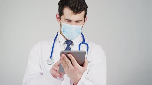 Doctor working on tablet