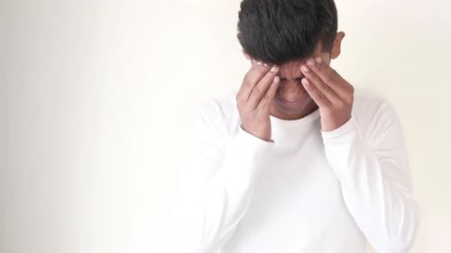 Adult Rubbing Temples Due To Headache