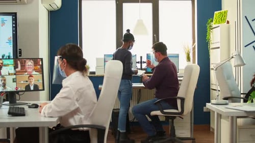 Employees working in a modern, safe office environment