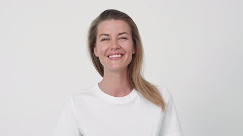 Happy Woman Smiling in a White T-Shirt