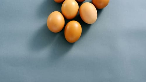Brown eggs on grey background