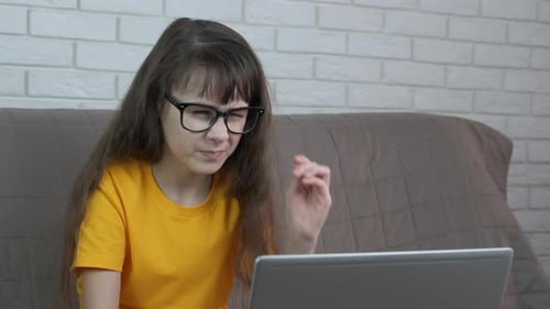 Tired Girl Rubbing Eyes at Computer