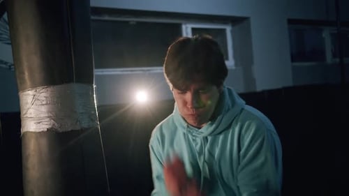 Alone Boxer Improves Boxing Movements in Dark Gym in Slow Motion