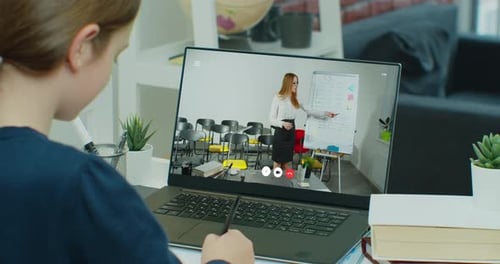 Child Attends Online Class Via Laptop Computer