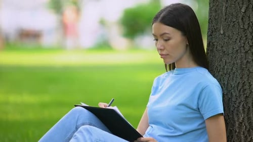 Female Student Writing Essay Sitting Park, Journalist Working Article, Notes