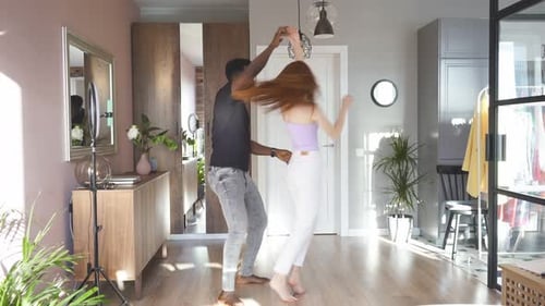 Happy Couple Dancing Together at Home