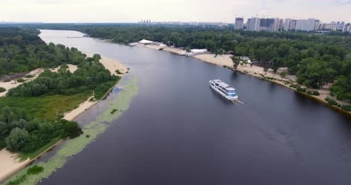 Passenger Ship Sails along City River Uplift