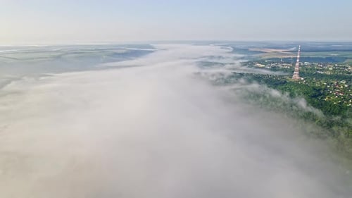 Aerial Drone View Above Wide River During Early Misty Morning