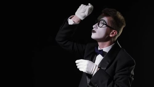 Mime Performs Invisible Actions in Tuxedo