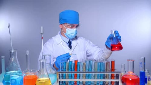 Scientist Working in Laboratory, Mixing Solutions