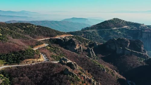 Aerial View of UNESCO Monument Meteora the Mountains the Landmark of Greece Fog Haze Over a Valley