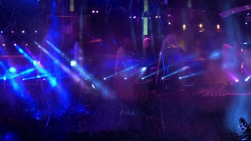 Large Crowd Enjoys Stage Lighting and Water Effects