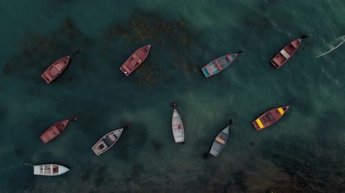 Aerial View of Colorful Boats on Calm Water