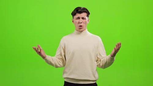 The Man is Standing and Looking at the Camera