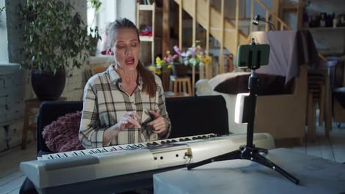 Woman Recording Music Lesson Video at Home