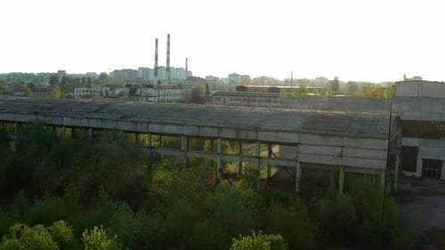 Aerial Drone Wide View. Flying Over Old Factory Ruin Industrial Building for Demolition in City
