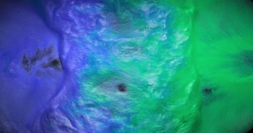 Green and Purple Purl Inks Are Melting Into Each Other Creating Beautiful Waves