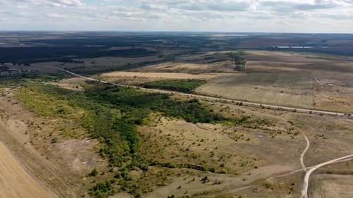 Highway on the Background of Wind Turbines and Blue Sky