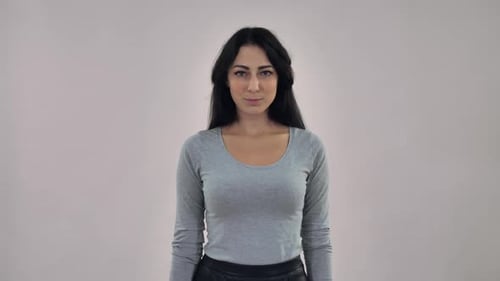 Smiling Woman Makes OK Hand Gesture