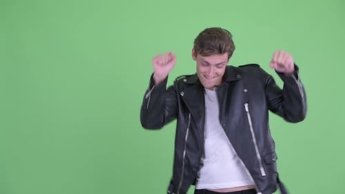 Young Adult Dances Happily in Leather Jacket