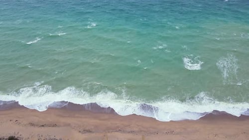High and powerful waves coming fast to the beach, waves in winter day