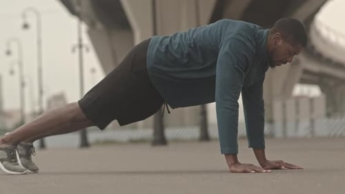 Man Doing Push-ups in an Urban Setting