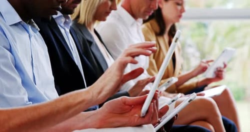 Business People Using Tablets in Bright Office