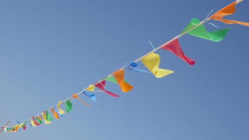 On the wind wayving colorfoul flags as beach decoration slow-mo 1080p HD footage - Slow motion colo
