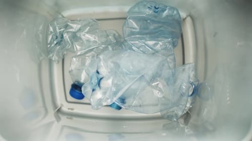 Aerial View into Recycling Bin Full of Plastic Bottles