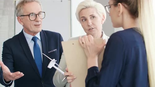 Close up of coworkers talking about renewable energy