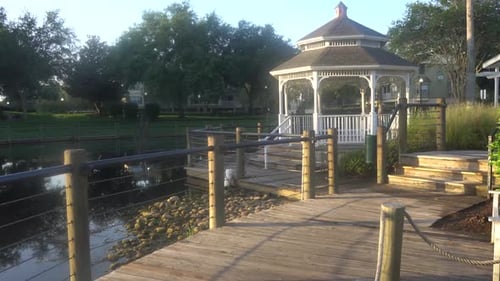 Gazebo next to a pond on a beautiful sunny morning ,