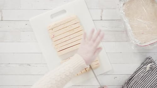 Confection Squares Being Cut on Board
