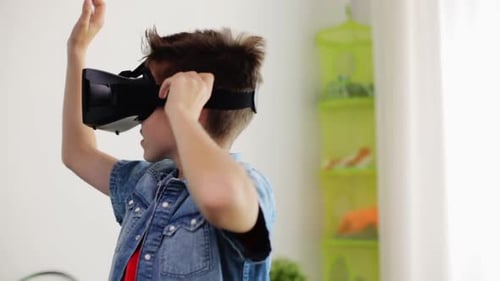 Excited Boy Using VR Headset Indoors