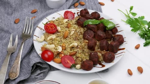 Artful Food Arrangement with Meatballs, Couscous, and Nuts