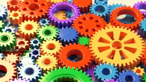 Technologiekonzept des menschlichen Gehirns, das mit bunten, sich drehenden Kunststoffzahnrädern erstellt wurde.