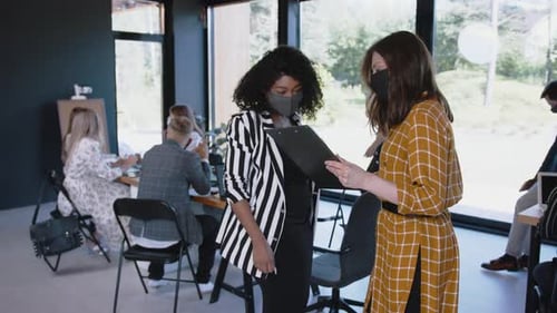 Team Meets Safely in Modern Open Office Space