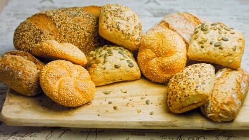 Freshly Baked Bread Variety on Wooden Board