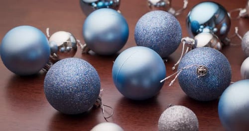Blue and Silver Christmas Ornaments on Table