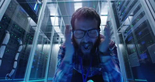 Man Overwhelmed in Bright Data Center Server Room