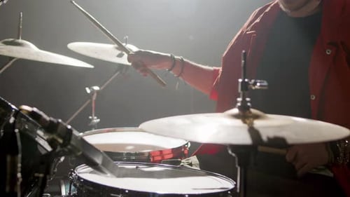 Young Male Drummer Playing Drums at Music Studio