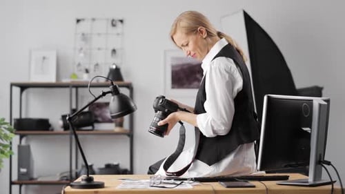 Female Photographer Sitting at Office