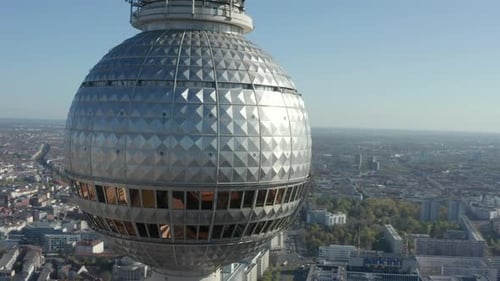 AERIAL: Super Close Up View Circle Around the Alexanderplatz TV Tower in Berlin, Germany on Hot