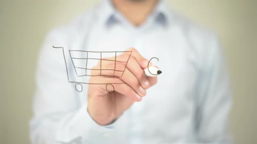 Adult Draws Shopping Cart on Clear Surface