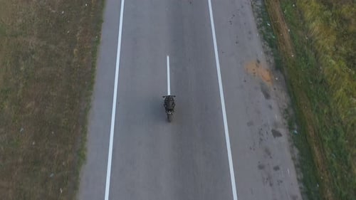 Aerial Shot of Motorcyclist Racing His Motorcycle on Country Road